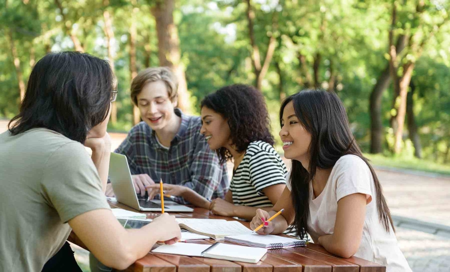 diverse students studying outside