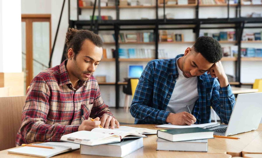 two black male students studying