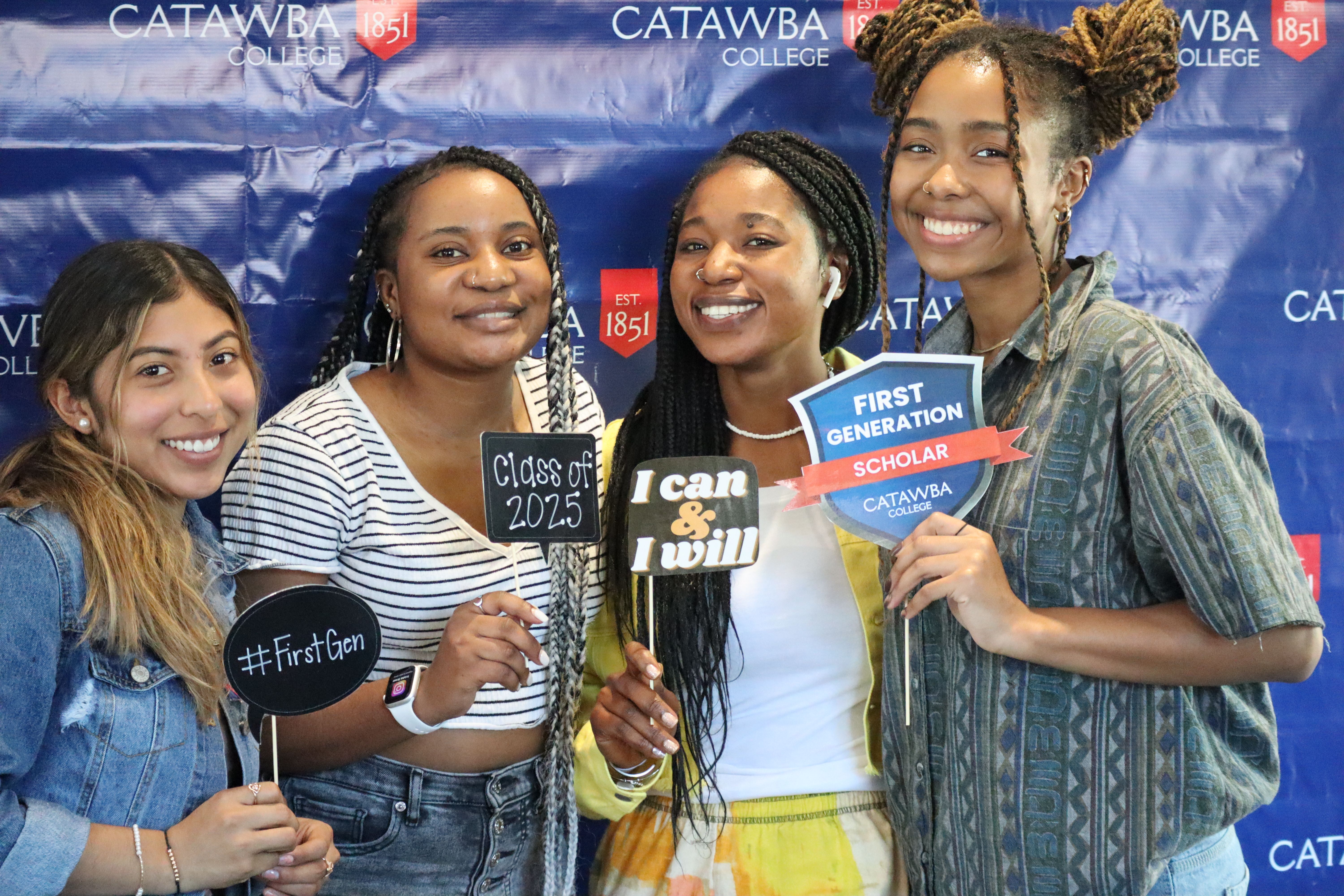 Four first-gen students at a photo booth at Catawba College event