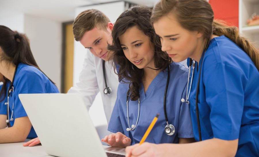 Medical Students looking at laptop computer