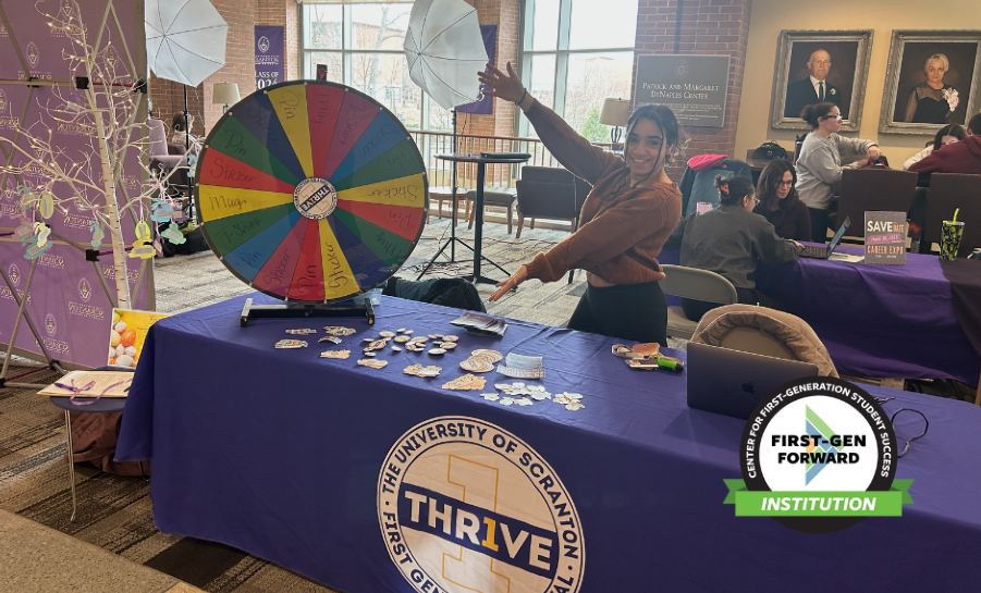 Student hosting table at a first-gen thrive event at University of Scranton